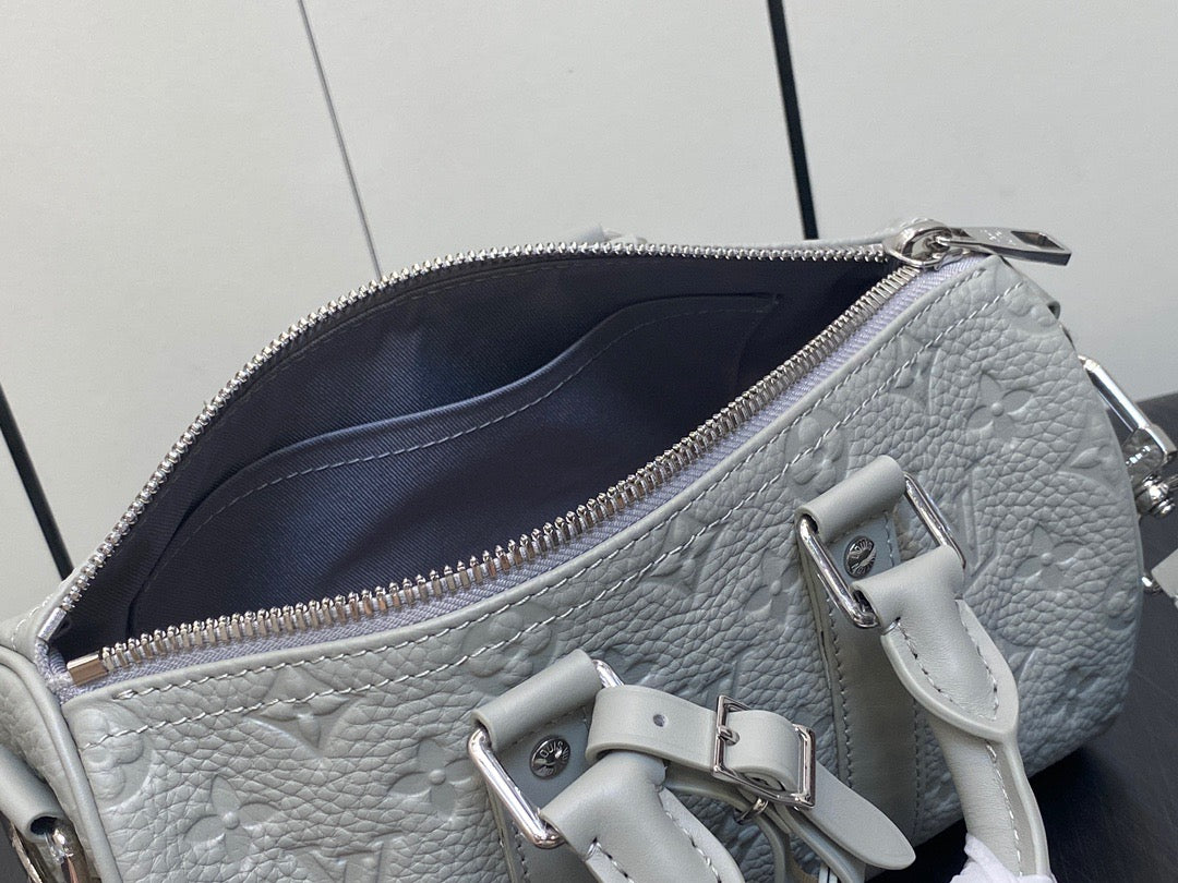 Louis Vuitton Keepall Bandouliere 25 Monogram Embossed White