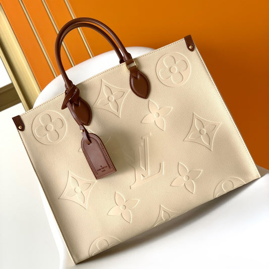 Louis Vuitton Onthego Handbags In Beige Embossed With Caramel Handle