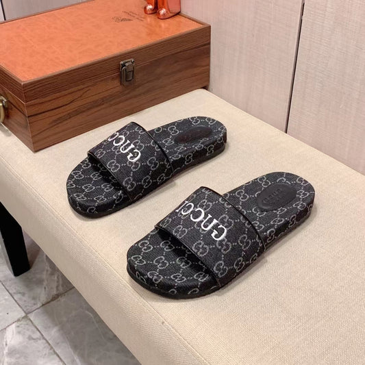 Gucci Men's GG Canvas Slides With Gucci Logo