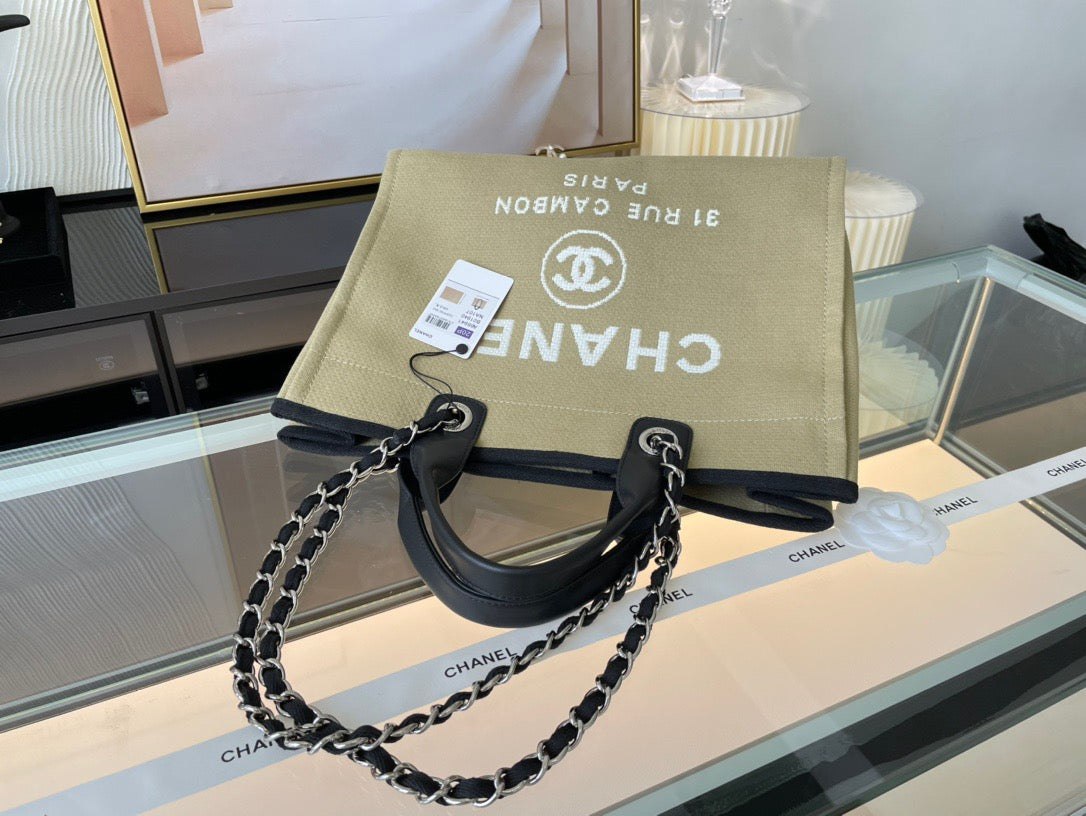 CHANEL Beach Canvas Tote Bag In Light Bown With Black Leather Strap