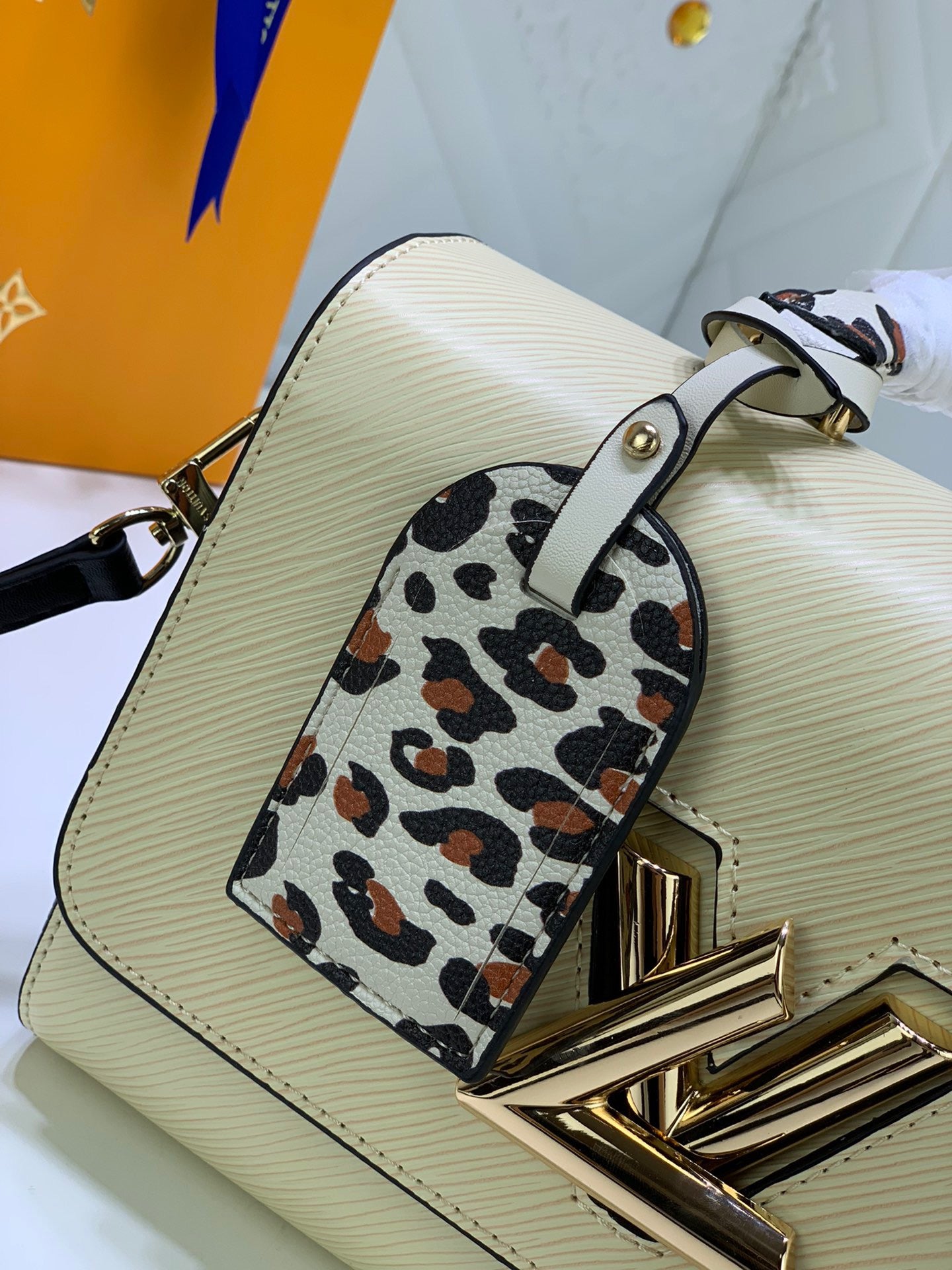 Louis Vuitton Twist Pouch In Beige Epi Leather With Leopard Print Handle