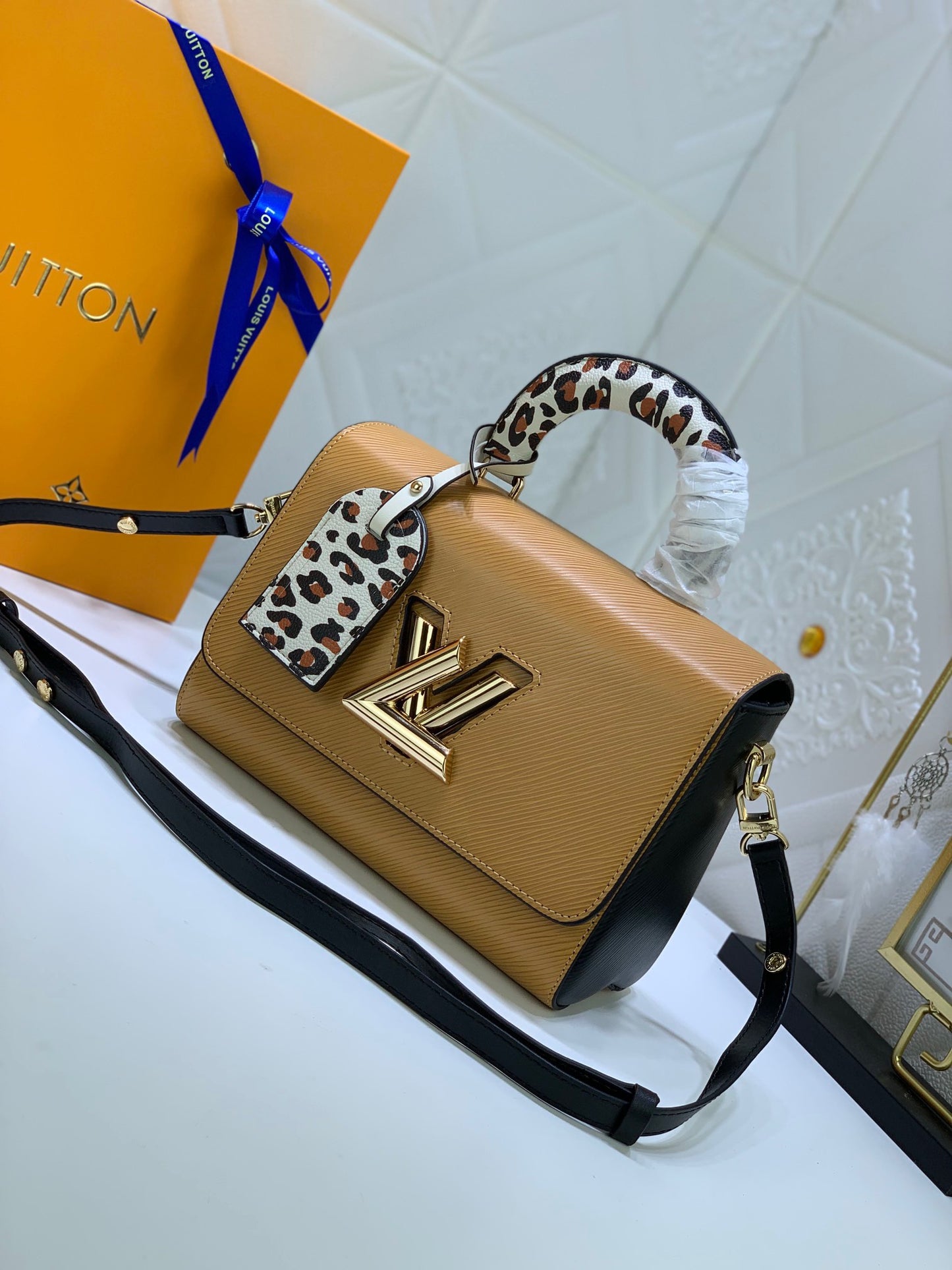 Louis Vuitton Twist Pouch In Brown Epi Leather With Leopard Print Handle