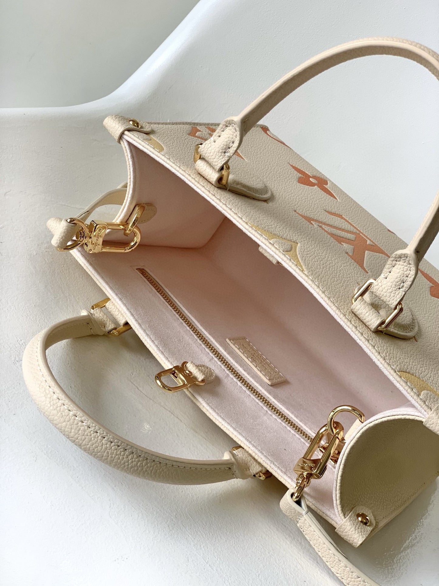 Louis Vuitton Onthego In Beige With Embossed Canvas Bag