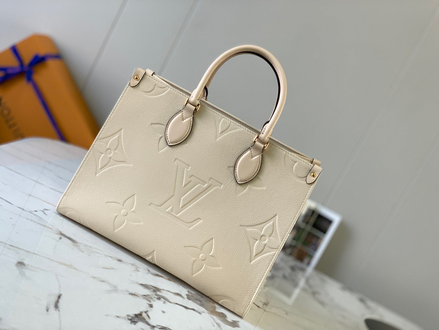 Louis Vuitton Onthego Handbags With Beige Embossed