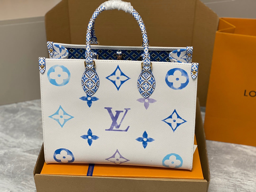 Louis Vuitton Onthego Handbags In White With Blue Embossed