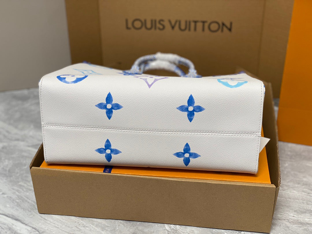 Louis Vuitton Onthego Handbags In White With Blue Embossed