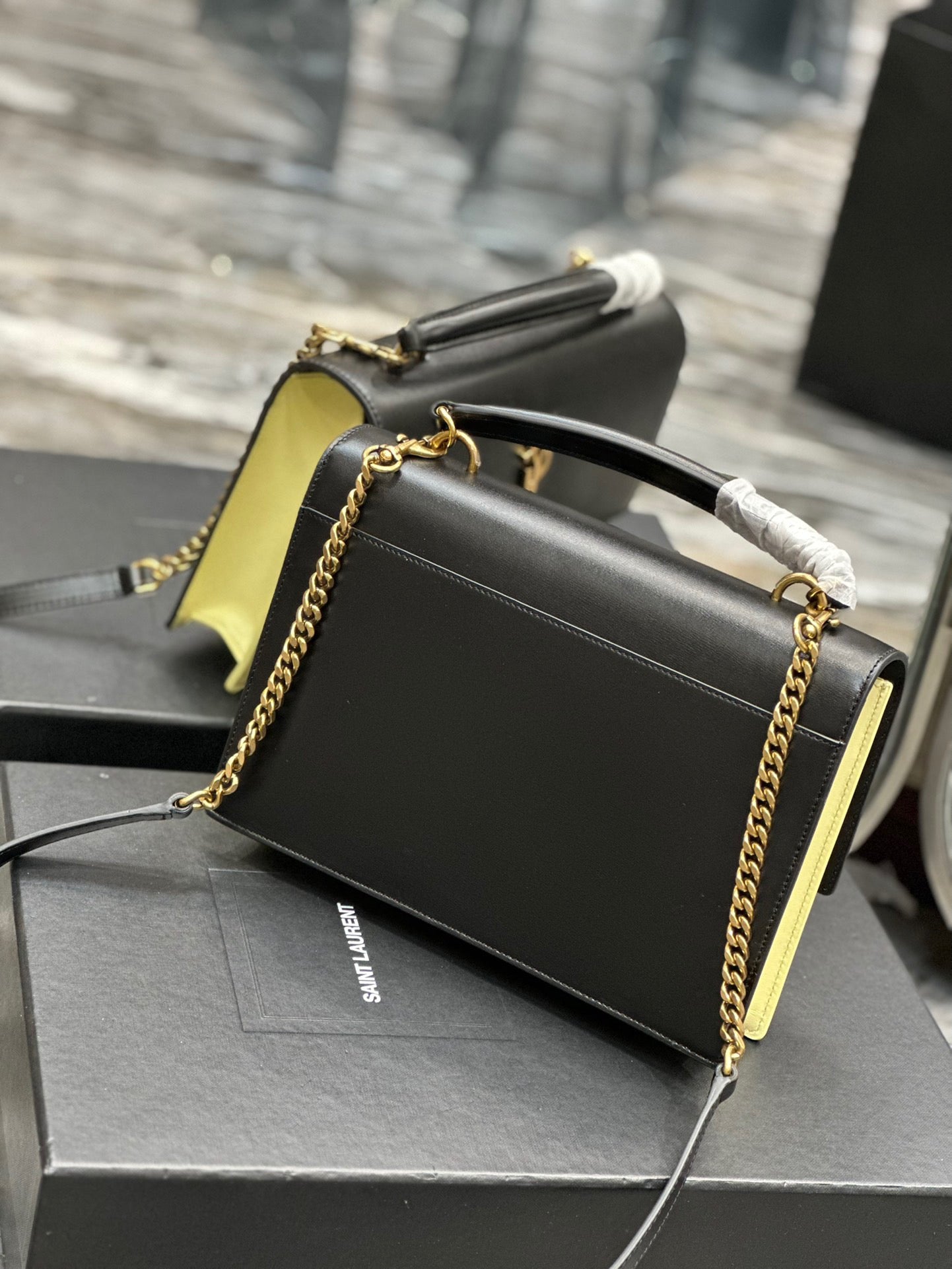 Saint Laurent Sunset Large Top Handle Bag In Black And Yellow Calfskin