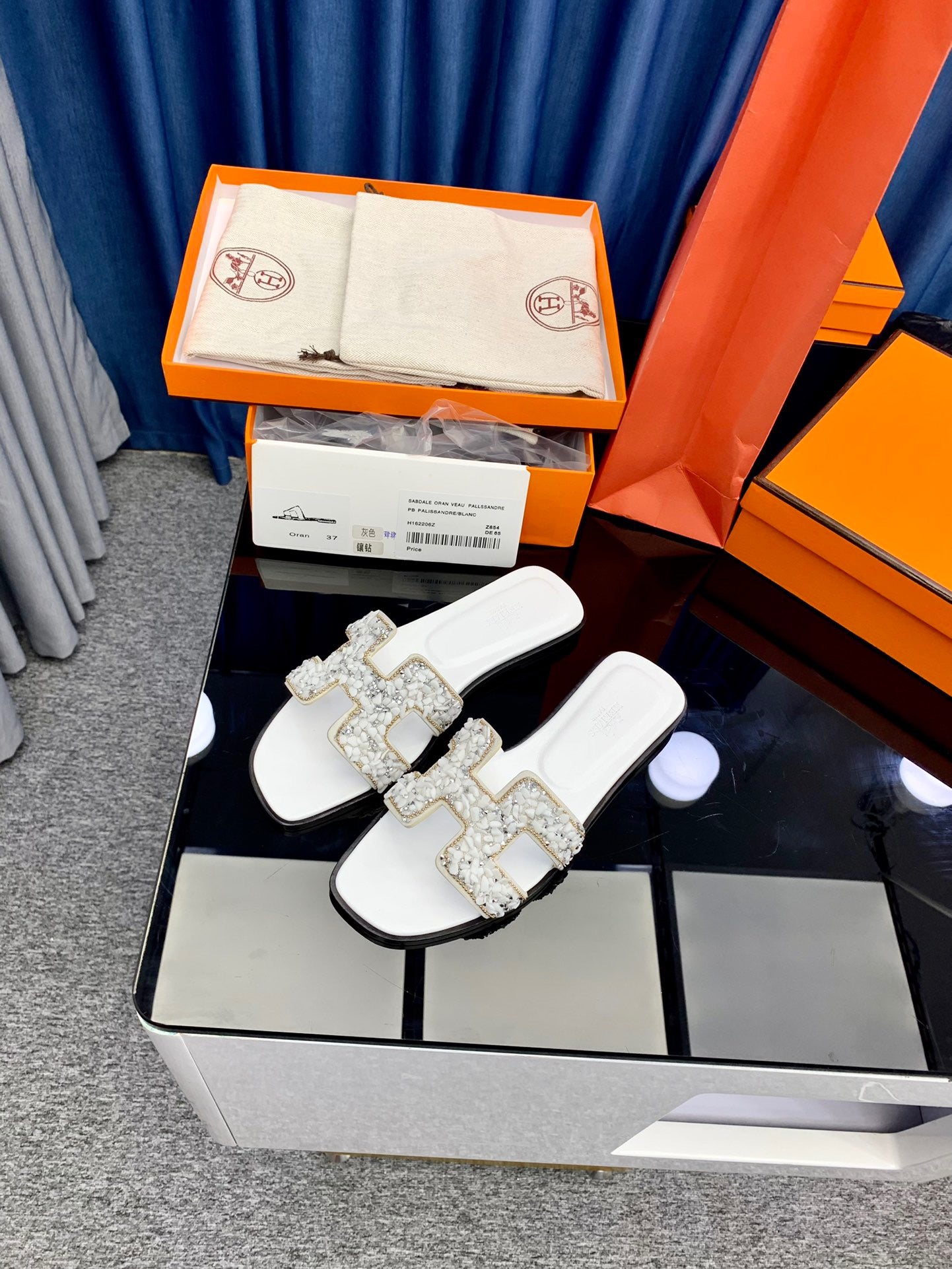 Hermes Oran Slides In White